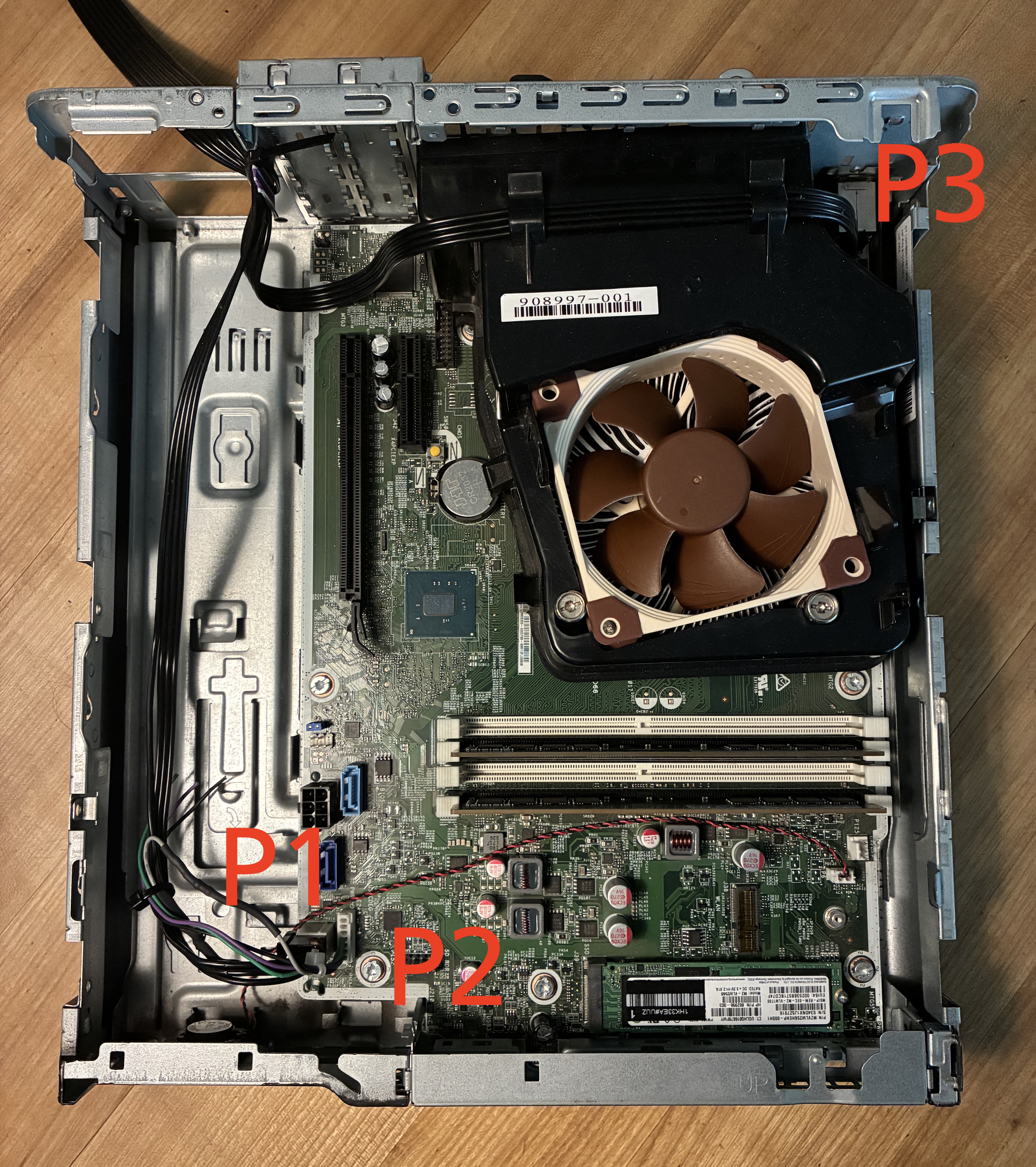 Top-Down view of the mainboard indicating the positions of the header. P1, P2 are right next to each other in the lower left corner, close to the front. P3 is in the upper right corner, somewhat hidden between the airflow duct and case wall.
